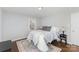Bright bedroom with hardwood floors, large windows, and overhead lighting at 3843 Foxford Pl, Charlotte, NC 28215