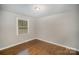 Bright bedroom with hardwood floors and neutral walls at 3843 Foxford Pl, Charlotte, NC 28215