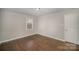 Bright bedroom with hardwood floors and neutral walls at 3843 Foxford Pl, Charlotte, NC 28215