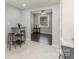 The dining area features a compact table, seamlessly connecting to the kitchen with sleek countertops at 3843 Foxford Pl, Charlotte, NC 28215