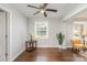 Bright dining room with fresh paint, hardwood floors, modern fixtures, and a ceiling fan at 3843 Foxford Pl, Charlotte, NC 28215