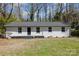 Charming single-story home featuring a freshly painted exterior, a modern roof, and a well-maintained front yard at 3843 Foxford Pl, Charlotte, NC 28215