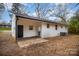 Rear view of house showing patio and backyard at 3843 Foxford Pl, Charlotte, NC 28215