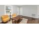Inviting living room with beautiful hardwood floors, neutral walls and ample seating at 3843 Foxford Pl, Charlotte, NC 28215