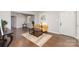 Hardwood floors and fresh neutral paint make this living room feel warm and inviting at 3843 Foxford Pl, Charlotte, NC 28215