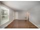 Hardwood floors and neutral walls in this open living room at 3843 Foxford Pl, Charlotte, NC 28215