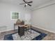 Bright home office featuring a ceiling fan, a rug, and a view to the outside at 3843 Foxford Pl, Charlotte, NC 28215
