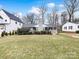 Charming gray brick ranch house with well-maintained lawn at 518 Hollis Rd, Charlotte, NC 28209