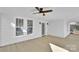 Spacious front porch featuring a ceiling fan and wood flooring at 518 S Race St, Statesville, NC 28677