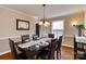 Formal dining room with hardwood floors and a table at 5438 Somerset Ln, Harrisburg, NC 28075