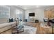 Open concept dining area with wood floors, modern furniture, and access to patio at 7228 Hodges Meadow Ln, Charlotte, NC 28213