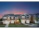 Attractive townhome exterior with two-car garage and landscaping at 7228 Hodges Meadow Ln, Charlotte, NC 28213