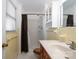 Bathroom with shower and yellow tiled walls at 760 Bethesda Rd, Statesville, NC 28677