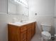 Bathroom with wood vanity and white tiled walls at 760 Bethesda Rd, Statesville, NC 28677