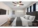 Primary bedroom with large bed and TV at 760 Bethesda Rd, Statesville, NC 28677