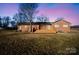 Brick house back view, showcasing a deck and yard at 760 Bethesda Rd, Statesville, NC 28677