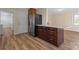 Kitchen with a large island, stainless steel refrigerator, and dark wood cabinets at 760 Bethesda Rd, Statesville, NC 28677