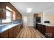 Bright kitchen with ample wood cabinets, stainless steel appliances, and light blue countertops at 760 Bethesda Rd, Statesville, NC 28677