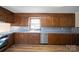 Well-lit kitchen featuring wood cabinets, stainless steel appliances, and a corner sink at 760 Bethesda Rd, Statesville, NC 28677