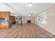 Open living room and kitchen with hardwood floors and fireplace at 760 Bethesda Rd, Statesville, NC 28677