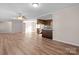 View of living room, kitchen, and hardwood floors at 760 Bethesda Rd, Statesville, NC 28677