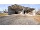 Spacious metal workshop with covered area and shelving at 760 Bethesda Rd, Statesville, NC 28677
