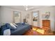 Bright bedroom featuring a queen bed, hardwood floors, and ample natural light at 7740 Robinson Church Rd, Charlotte, NC 28215