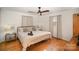 Spacious bedroom with a king-size bed and ceiling fan at 7740 Robinson Church Rd, Charlotte, NC 28215