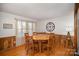 Bright dining room features a round wooden table with six chairs at 7740 Robinson Church Rd, Charlotte, NC 28215