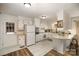 White kitchen features ample counter space and updated flooring at 7740 Robinson Church Rd, Charlotte, NC 28215