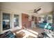 Relaxing screened porch with ceiling fan and comfortable seating at 7740 Robinson Church Rd, Charlotte, NC 28215