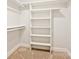 Spacious closet with built-in shelves and hanging rods at 8800 Crestwood Dr, Mount Pleasant, NC 28124