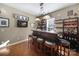 Stylish bar room featuring hardwood floors, custom counter, bar stools and a cozy atmosphere at 1007 Orchid Ln, Fort Mill, SC 29707