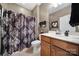 Well-maintained bathroom with tiled shower, classic vanity, and framed mirror at 1007 Orchid Ln, Fort Mill, SC 29707