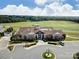 Exterior shot of the Sun City Carolina Lakes clubhouse with well-manicured landscaping and ample parking at 1007 Orchid Ln, Fort Mill, SC 29707