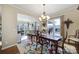 Elegant dining room with chandelier, hardwood floors, and bright windows at 1007 Orchid Ln, Fort Mill, SC 29707