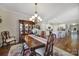 Formal dining room featuring a beautiful china cabinet and bright light fixtures at 1007 Orchid Ln, Fort Mill, SC 29707