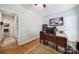 Spacious home office featuring hardwood floors, a modern desk setup, and ample lighting at 1007 Orchid Ln, Fort Mill, SC 29707