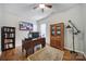 Bright home office with built-in shelving, hardwood floors, and a decorative rug at 1007 Orchid Ln, Fort Mill, SC 29707