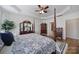 Spacious main bedroom featuring hardwood floors, tray ceilings, and elegant furnishings at 1007 Orchid Ln, Fort Mill, SC 29707