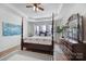 Large main bedroom featuring a ceiling fan, hardwood floors, and lots of natural light at 1007 Orchid Ln, Fort Mill, SC 29707