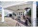 Relaxing covered patio with brick flooring, a ceiling fan, and comfortable outdoor seating with a view at 1007 Orchid Ln, Fort Mill, SC 29707