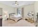 Bedroom featuring neutral carpet, modern vanity with storage and natural light from the window at 107 E Cold Hollow Farms Dr, Mooresville, NC 28117