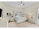 Bright bedroom with a ceiling fan, light colored walls, window, and a carpeted floor at 107 E Cold Hollow Farms Dr, Mooresville, NC 28117