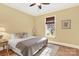 Bedroom featuring wood trim, bamboo window shades, carpeted floor, and neutral decor at 107 E Cold Hollow Farms Dr, Mooresville, NC 28117