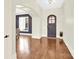 Spacious foyer with beautiful wood flooring and detailed trim leads to a dining room at 107 E Cold Hollow Farms Dr, Mooresville, NC 28117