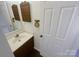 Bathroom with vanity, sink, and wood cabinets at 10945 Carmel Crossing Rd, Charlotte, NC 28226