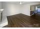 Living room with hardwood floors, fireplace, and view to kitchen at 10945 Carmel Crossing Rd, Charlotte, NC 28226