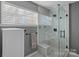 Modern bathroom featuring a glass-enclosed shower with marble tiling and a sleek vanity, providing a spa-like experience at 11414 Coreopsis Rd, Charlotte, NC 28213