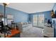 Functional bedroom with natural light, a daybed, a desk, and a cozy rug, creating a versatile living space at 11414 Coreopsis Rd, Charlotte, NC 28213